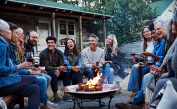 Group of friends and family relaxing around a fire pit. Professional construction workers. Father tossing his daughter in the air. Learn more about quitting tobacco and getting support to quit.