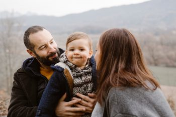 Family in a park by the river